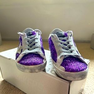 Golden Goose super-star sneakers with purple glitter and lettering on the foxing